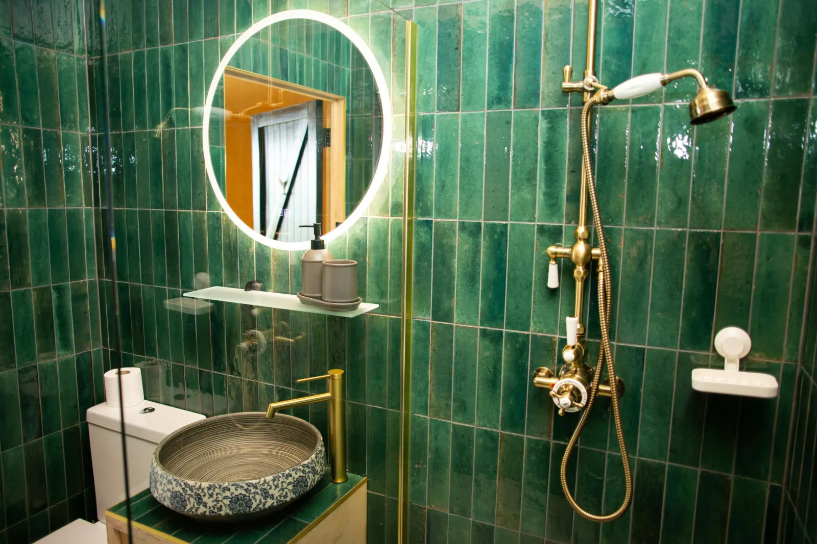 Fully tiles bathroom with electric shower cubicle
