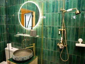 Fully tiles bathroom with electric shower cubicle
