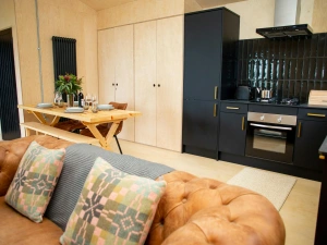 Kitchen with lots of storage and dining table with bench and chairs