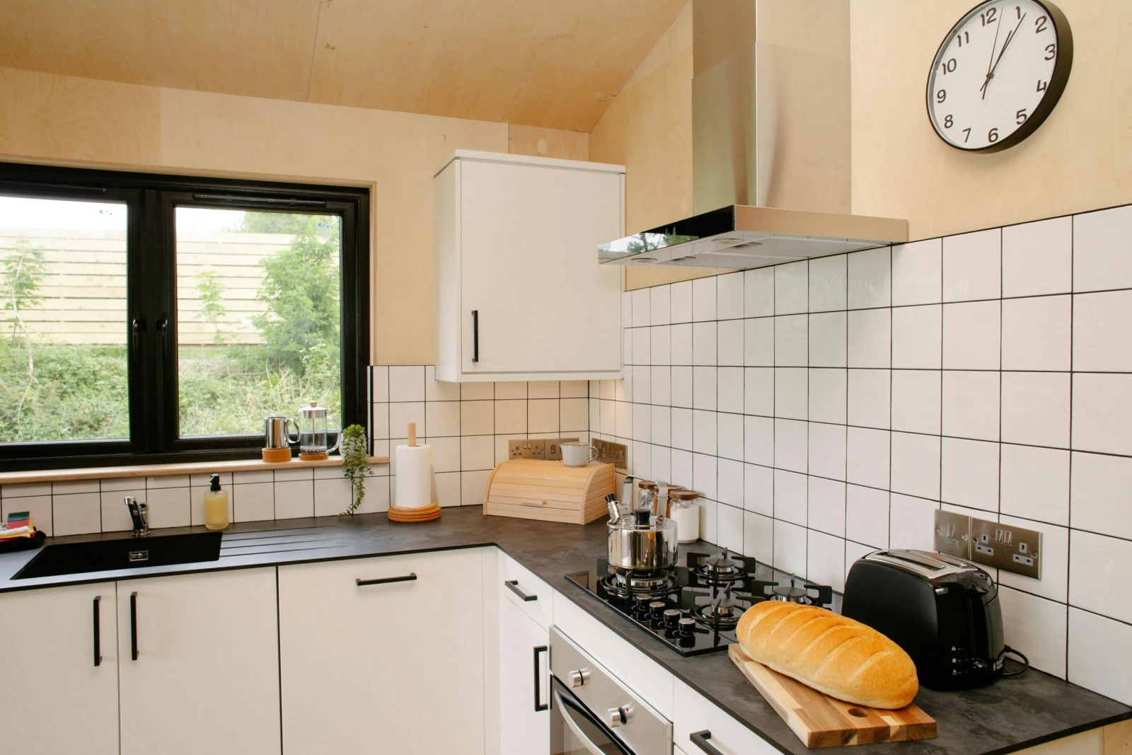 Kitchen with white wall and base cupboards