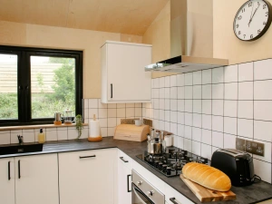 Kitchen with white wall and base cupboards
