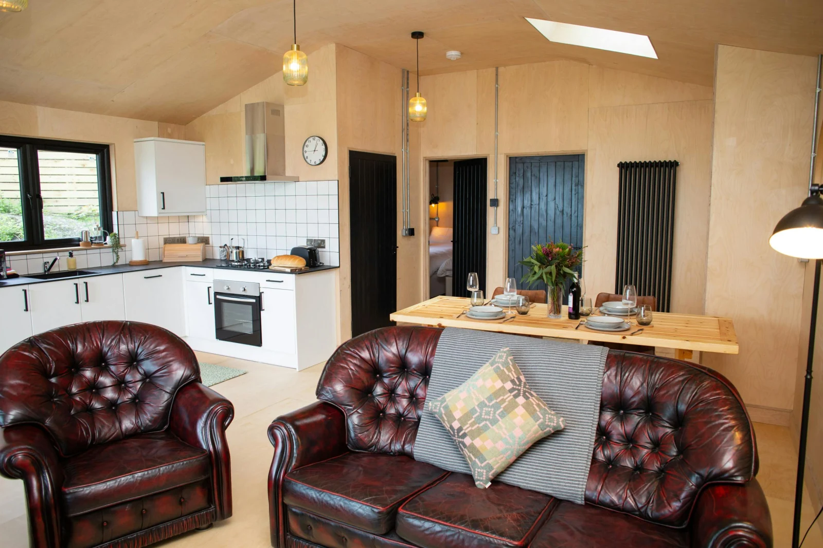 Sitting area with leather sofa and armchairs