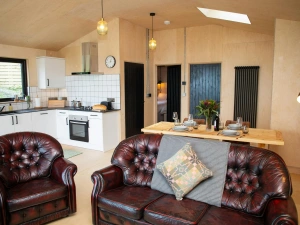 Sitting area with leather sofa and armchairs