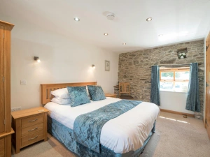 King size bed, bedside cabinets, wardrobe, chair and window