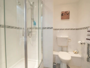 Shower room at Eirlys, shower cubicle, toilet and heated towel rail